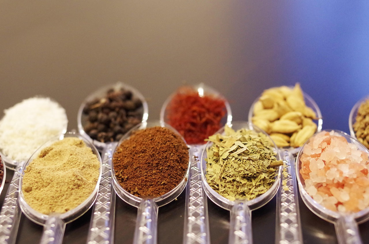 Ayurvedic herbs and spices arranged in spoons